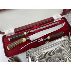Silver plated Calibri lighter, in the form of a twin handled vase with mask handles, together with a pair of silver plated candle sticks, horn handled carving set with hallmarked silver ferrules and other silver plated items
