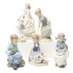 Four Lladro figures and two Nao examples, including Cinderalla, girls picking flowers, gir...