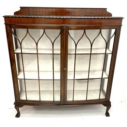 Early 20th century mahogany display cabinet, raised shipped back, two glazed doors enclosing two lined shelves, cabriole ball and claw feet