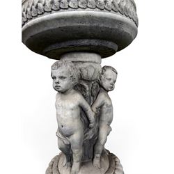 Cast stone cherub bird bath, circular removable top raised on three cherubs with ornate detailing