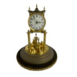 Torsion 400 day anniversary clock with a glass dome and suspension.