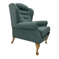 Sherborne England Lyndon fireside armchair, upholstered in Highland Baltic fabric, light oak legs