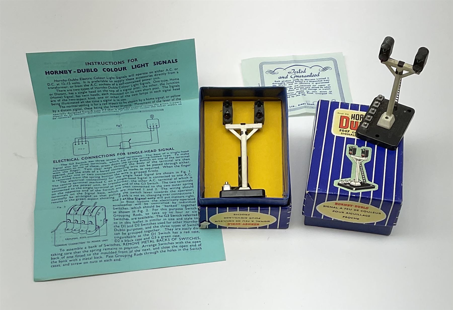 Hornby Dublo - twelve electric semaphore signals comprising four ED1 Single Arm; two ED2 Double Arm; one ED3 Junction Signal Upper Quadrant; one 5045 Colour Light Signal - Single (Home); two ES6 Colour Light Signal -Single (Distant); and two 5047 Colour Light Signal - Junction (Home); all boxed (12)