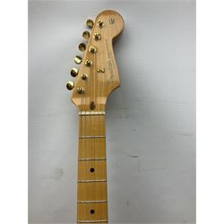 Fender Stratocaster 50th Anniversary 2004 metallic gold electric guitar; serial no.MZ4116369; L98cm; in Spider fitted case with owners manual and other paperwork, strap and belt buckle etc