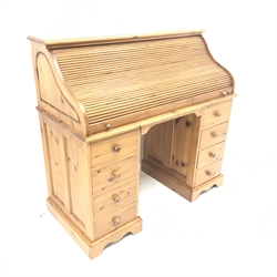Solid pine twin pedestal shaped tambour roll top desk, fitted interior, eight drawers, shaped plinth base, W117cm, H111cm, D55cm