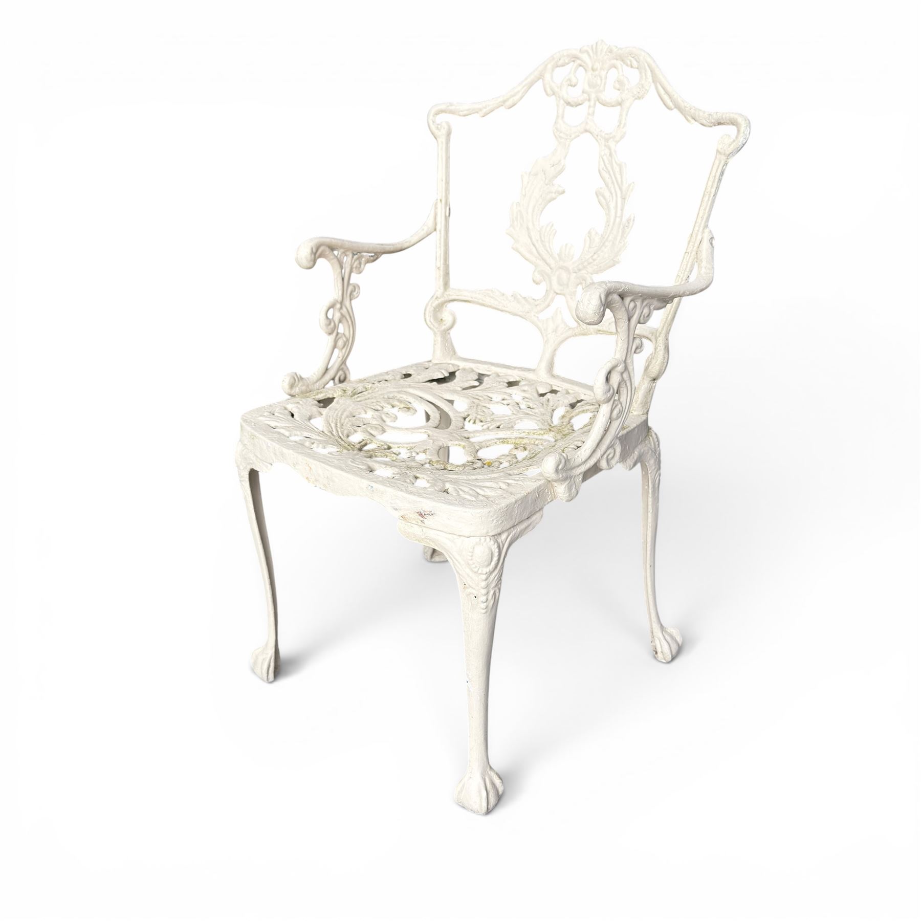 Victorian design cast aluminium garden table and twin armchairs featuring a pierced floral wreath splat, over a stylised scrolling acanthus leaf seat, including parasol