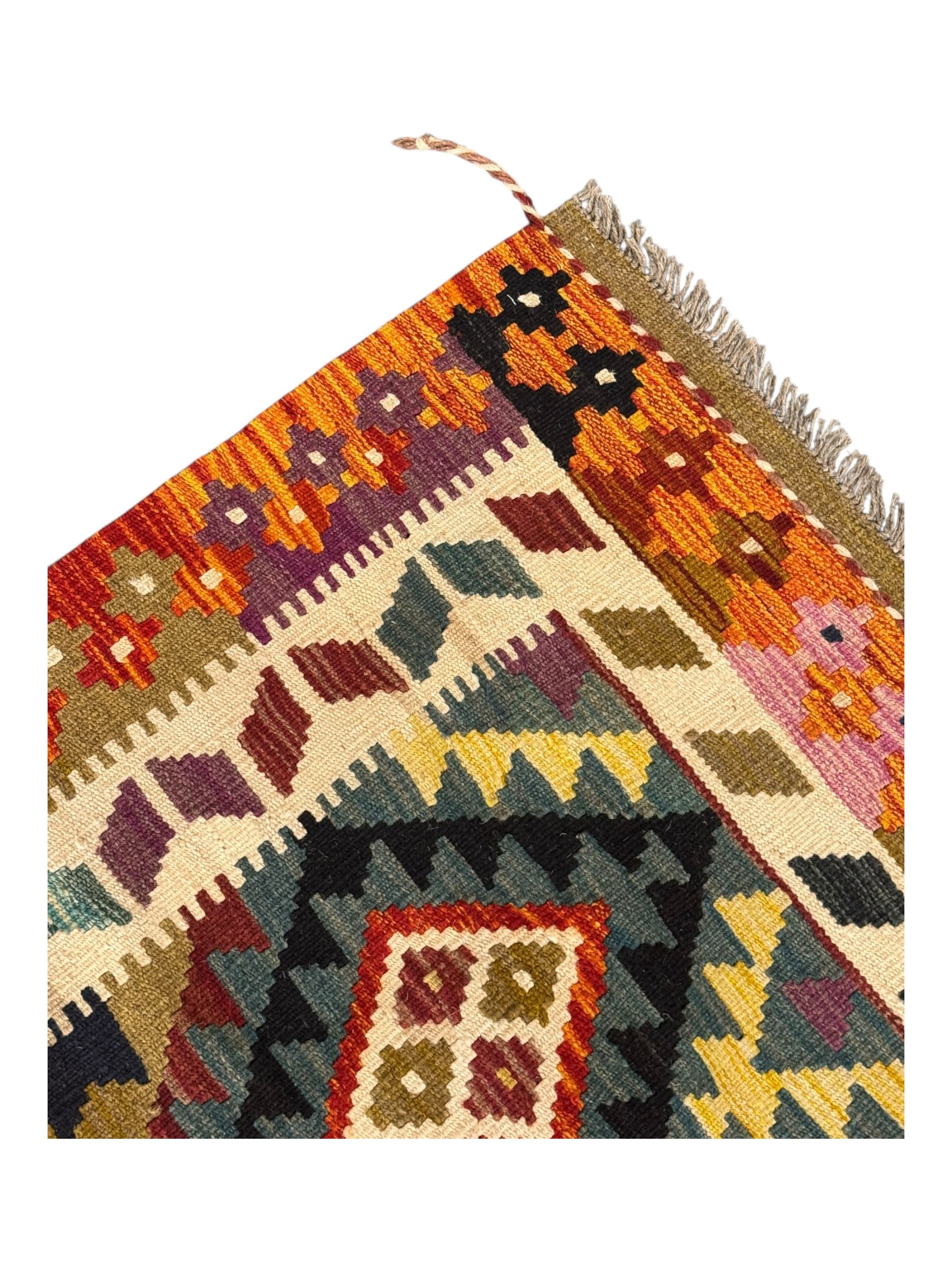 Afghan Maimana Kilim flatweave rug, dark teal ground with a multicoloured diamond lattice, framed by a wide border of stylised motifs, finished with braided corner tassels