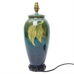 Moorcroft 'Hibiscus' pattern table lamp on green ground, including stand and fittings H42cm