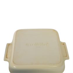 Le Creuset ceramic kitchen wares in cream and light blue, including pie dishes, baking dishes, petit casseroles etc  
