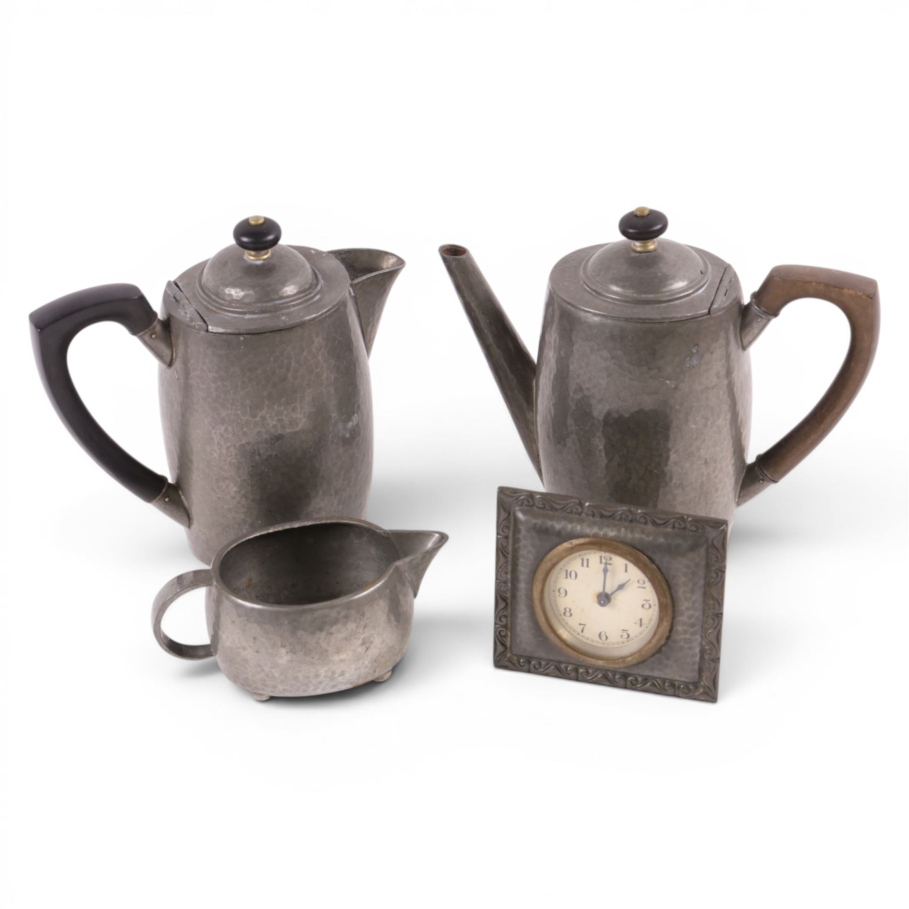 Tudric pewter part coffee set, coffee pot, hot water jug and milk jug, together with a Tudric pewter clock