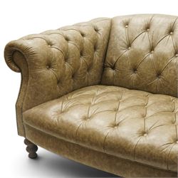 Tetrad - 'Matisse' grande three-seat sofa, Chesterfield shape with rolled arms flanking a serpentine back and front, upholstered in buttoned tan leather with close-nailed studwork, on turned feet