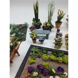 1:12 scale dolls house allotment and garden accessories, including wooden shed on a stone effect base, two vegetable patches, terracotta plant pots with flowers and foliage, stone effect plant pots, other planters, loose sunflowers, scarecrow, rabbit hutch, garden tools, fencing panels, etc 