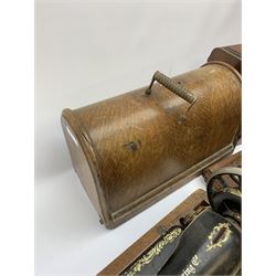 Two vintage sewing machines, the first marked Federation, in mahogany case, the second marked Singer, in oak case. 