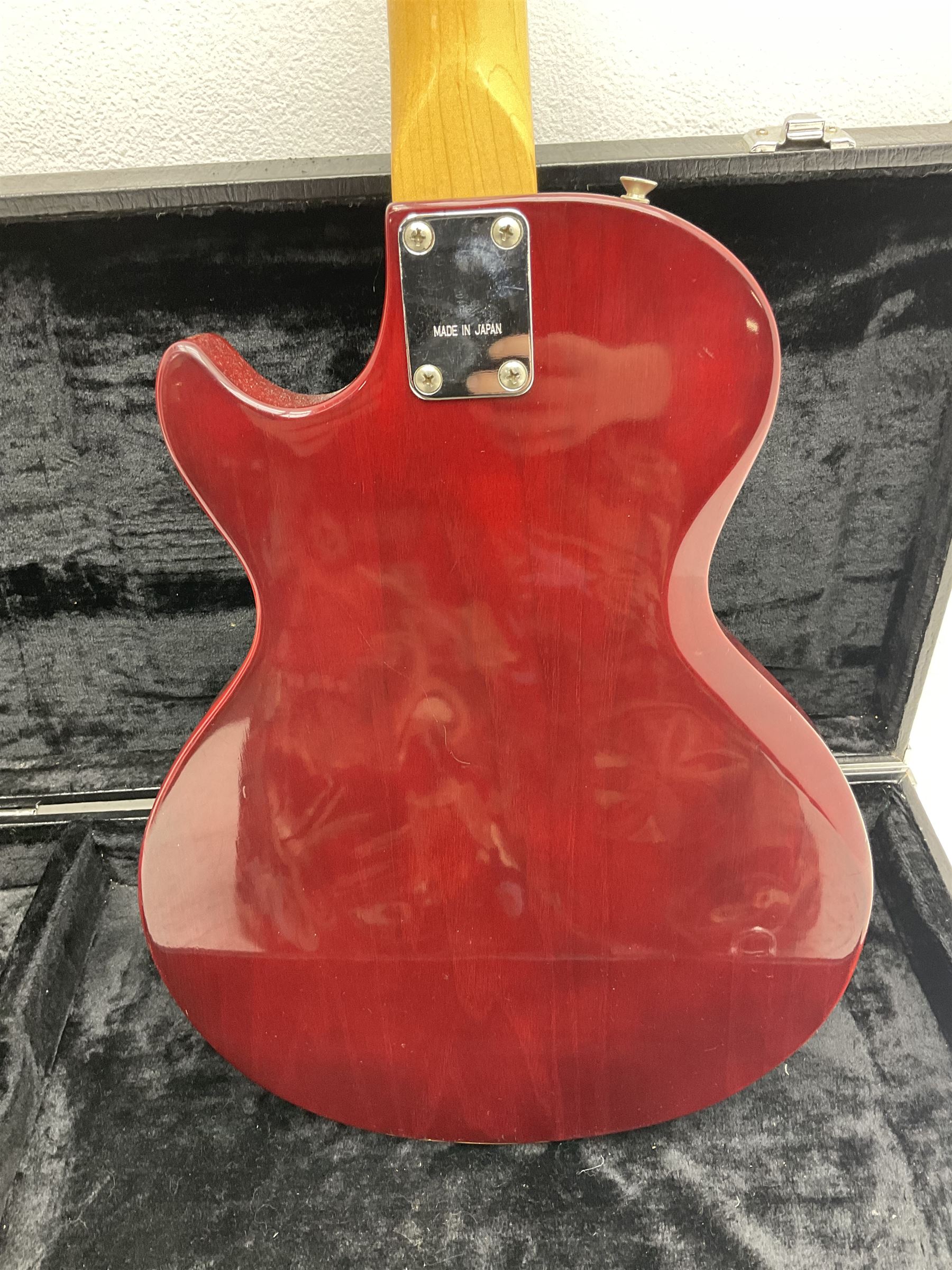Gibson Marauder style six-string electric guitar with cherry coloured body, marked made in Japan L101cm; in locking hard carry case