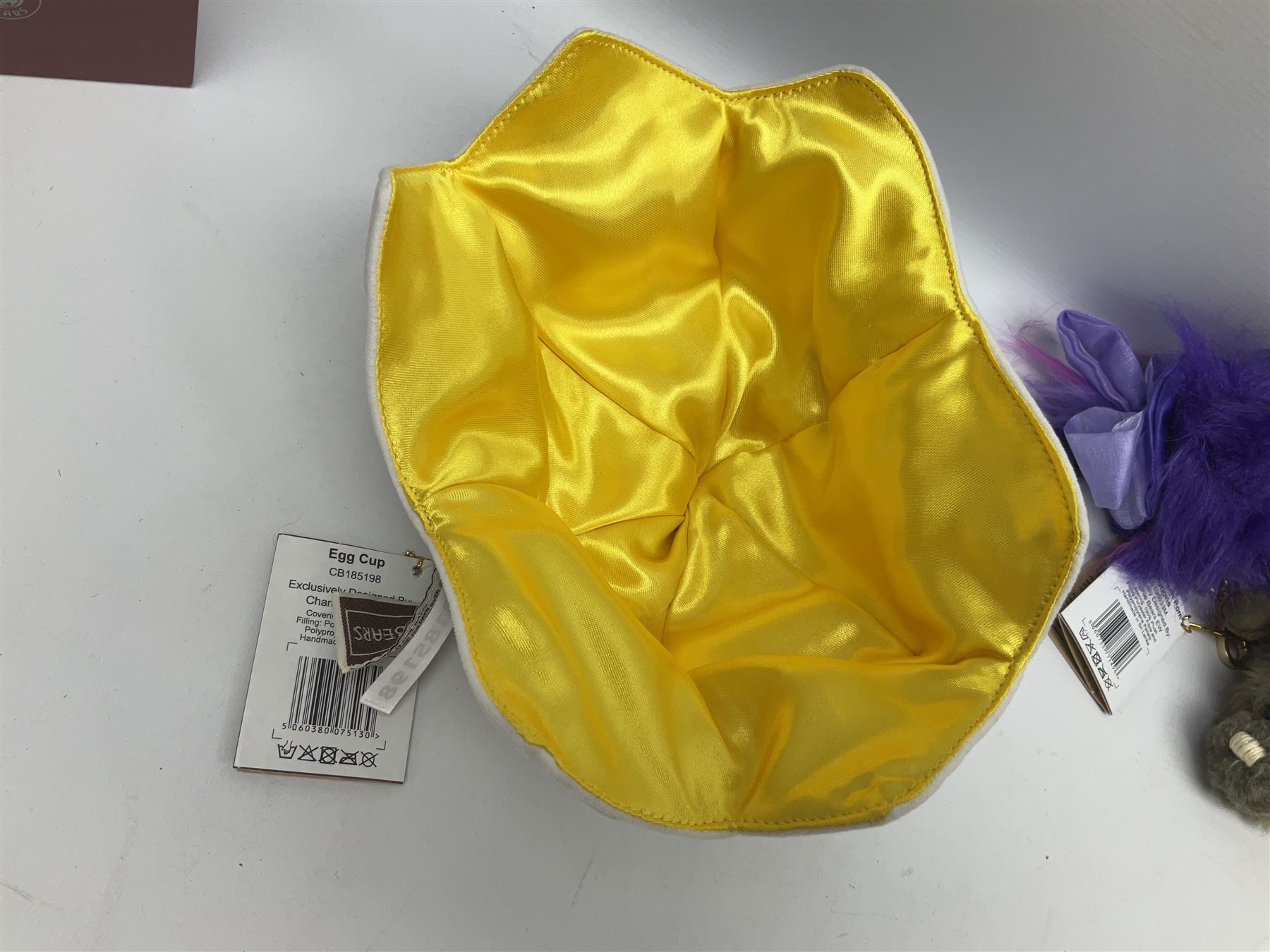 Five Charlie Bears Plush Hug Book Collection books, comprising Guide To Snuggleability containing Snuggleability CB191971F, Paw-Some Facts Directory containing Pawsome CB191971D, Bear Therapy Handbook containing Bear Therapy CB191971E, Study Buddy Handbook containing Study Buddy CB191971A, and Guide to Being Bear-illiant CB191971B, each designed by Isabelle Lee, each with tags, plus Charlie Bears Secret Hug Book (lacking contents), together with assorted Charlie Bear accessories, to include two Bear Ears Duffle headbands CBBEARSDUF, Egg Cup CB185198 , Incy Wincy CB205252AO, with tag, four key rings, all with tags, Bear Care Kit and contents, recipe cards, pin badges, tape measure, notebook, etc., (Qty)