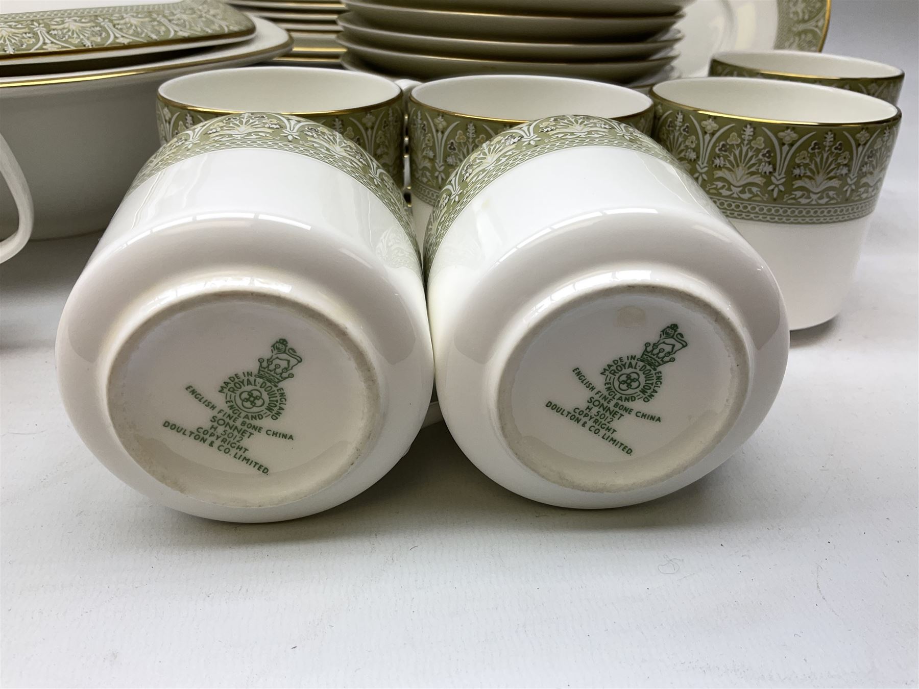 Royal Doulton Sonnet pattern part tea and dinner service, including  twelve dinner plates, twelve bowls, twelve side dishes, two covered tureens, one meat platter, coffee pot, twelve coffee cans and saucers etc (approx 90)