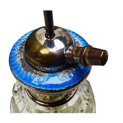 Art Deco thirteen piece silver mounted blue guilloche enamel dressing table set, comprising two hair brushes, two clothes brushes, hand mirror, two cut glass jars, buffer and a cut glass scent bottle, hallmarked J W Tiptaft & Son Ltd, Birmingham 1930 and 1932, and a silver handled manicure set, hallmarked Daniel Manufacturing Company, Birmingham 1930, with a pair of base metal scissors, each contained within three original fitted cases with black and cream silk and velvet lined interiors, one with removable mirror