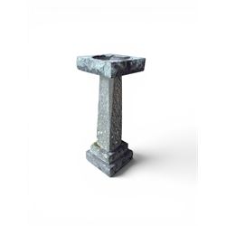 19th century weathered sandstone birdbath, formed in four sections, square top with carved shell bath, raised on tapering column with stepped base
