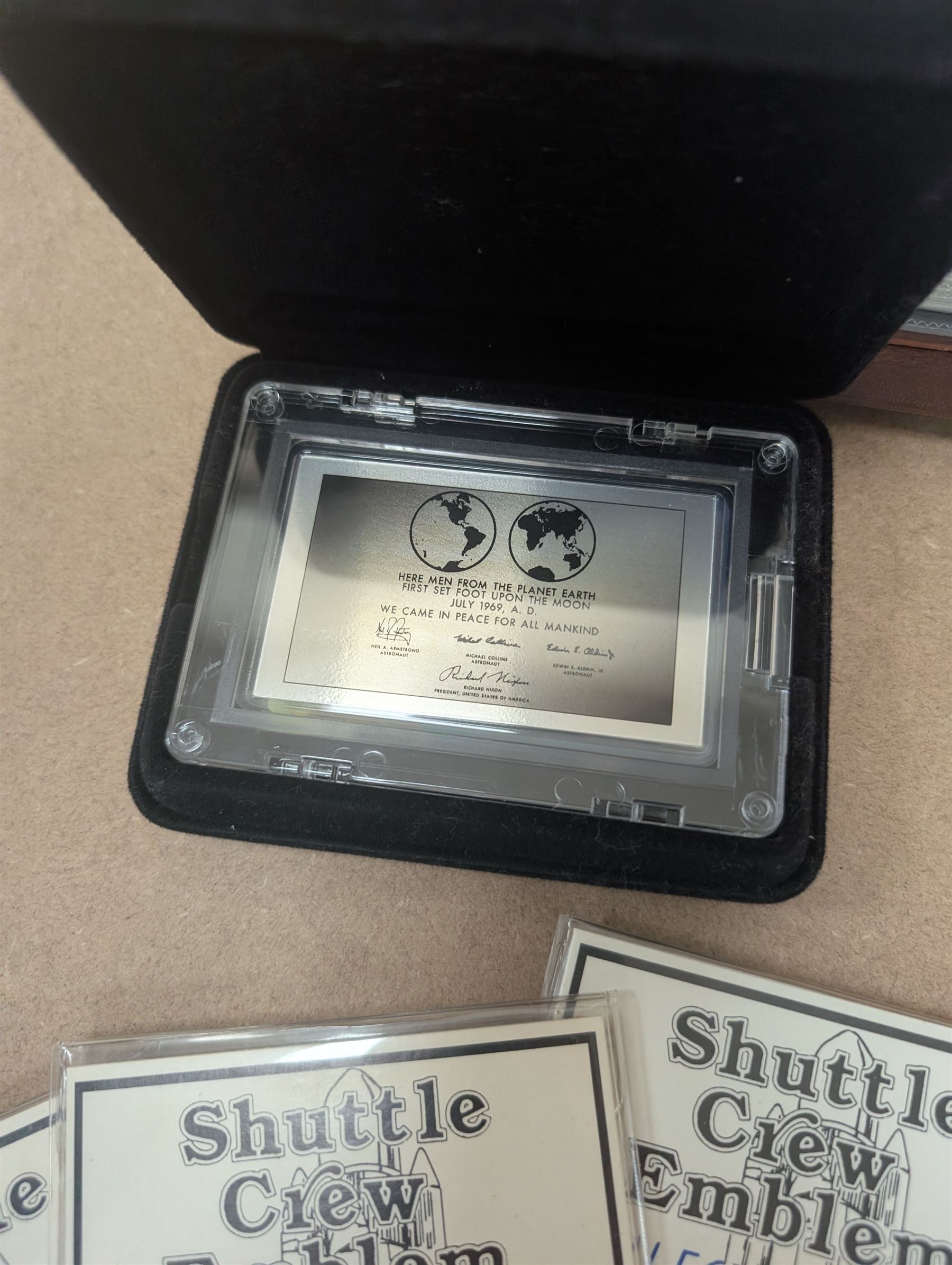 Nasa Space Shuttle program commemorative items, including album of stamp covers, telephone cards, five Shuttle Crew Emblem Collector's Series medallions, Maiden Flights bronze medallions, Missions of the Orbiter Challenger set of medallions and Apollo series medallions