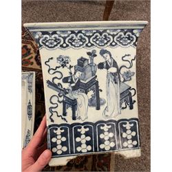 19th century Chinese blue and white planter and stand, each of square slightly tapering and flared form, the planter decorated with figures and precious objects between stylised foliate borders, the stand decorated with landscapes beneath a lipped rim with cell band, planter H28cm D25.5cm, stand H7cm D26cm