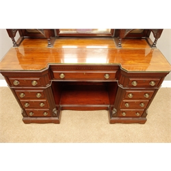  Quality late Victorian mahogany dressing table, two raised cupboards supporting bevelled mirror, enclosed by carved panelled doors, inverse moulded break front top above nine as lined drawers around a knee hole, locks stamped 'H' with arrow, W143cm, H183cm, D60cm   