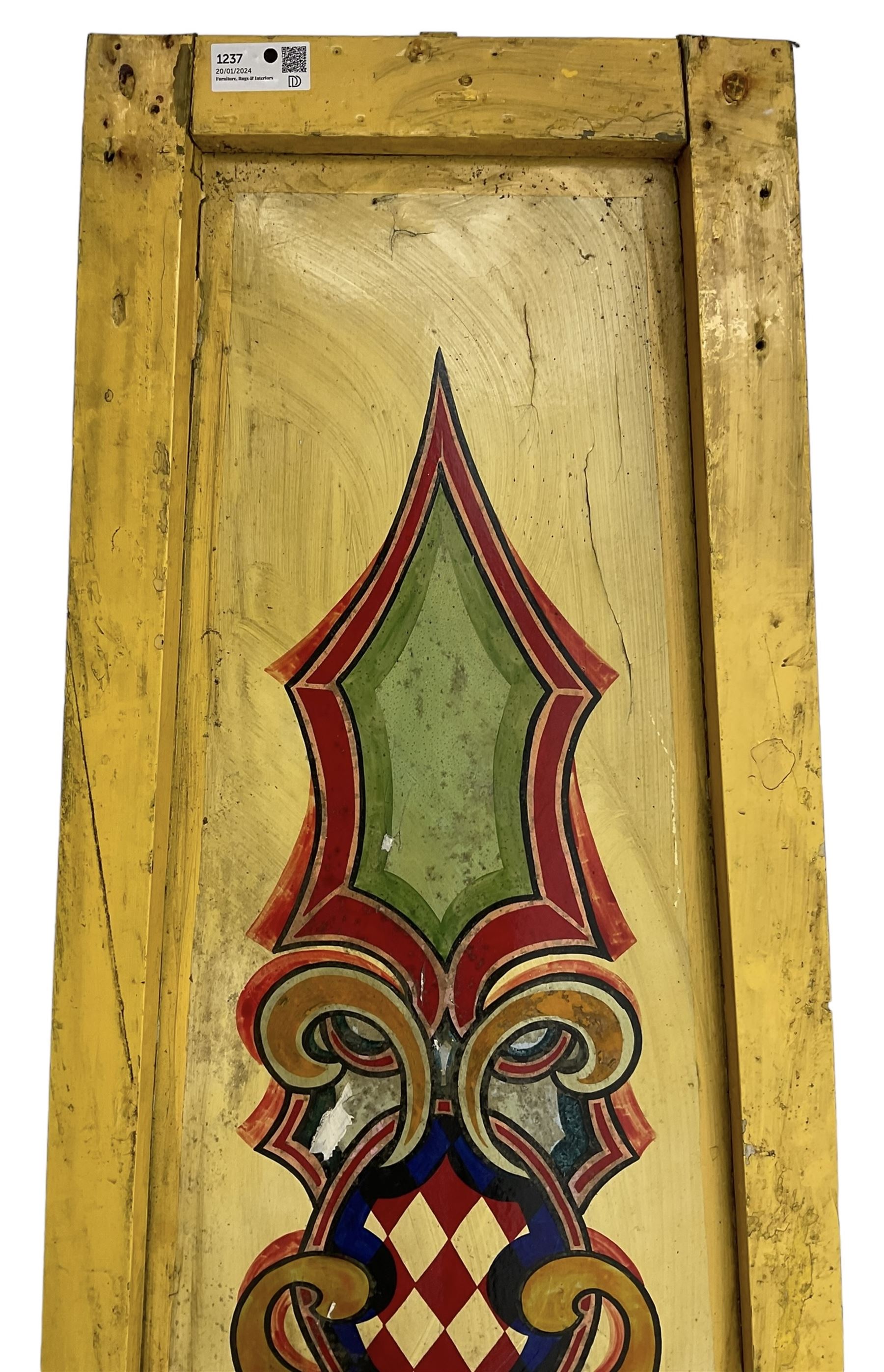 Two early 20th century fairground 'Chair-O-Plane' panels, wooden framed with sheet metal panels, painted in yellow with scrolled cartouche decoration in red, gold and green