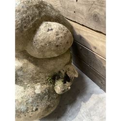 Four grotesque garden wall masks