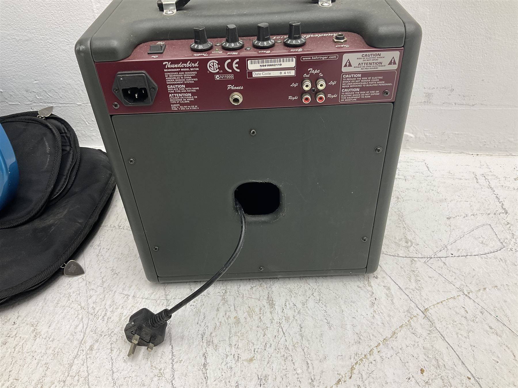 Richwood electric bass guitar in blue, cream and natural finish L117cm; in Fender soft carrying case; together with Behringer Thunderbird Bx108 amplifier date code 0 4 11.