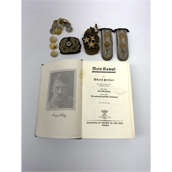 WW2 Kreigsmarine uniform accessories from prisoner of war U-boat Kapitanleutnant Gunther Lorenz comprising cap badge, pair of epaulettes, thirteen buttons marked 1940 and roll of rank braiding and stars; together with copy of Adolf Hitler's Mein Kampf. 1936 published by Zentralverlag Der NSDAP Munchen with German text.