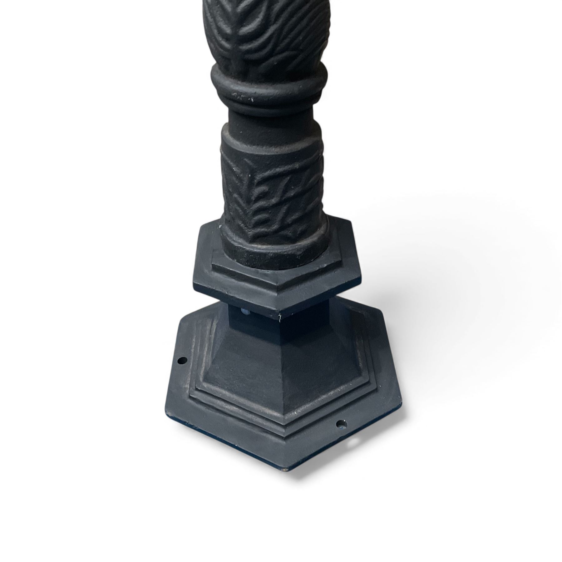 Victorian-style cast iron lamp post in a black finish,