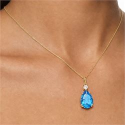 18ct gold Swiss blue topaz and diamond pendant necklace, single pear cut topaz of approx 6.60 carat, suspending from a single round brilliant cut diamond of approx 0.15 carat