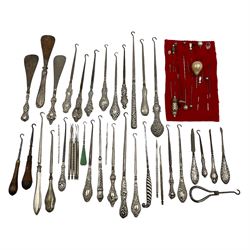 Collection of buttonhooks, shoe horns and manicure items, twenty-three with silver handles, two stamped 800 and others hallmarked, Buttonhooks: A Guide For the Collector' by Jackie Booker and sixteen hatpins