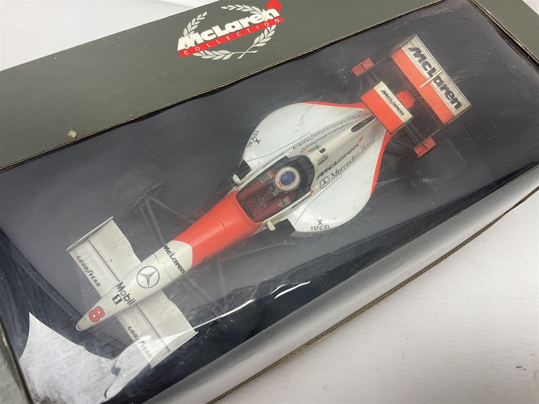 Three Paul's Model Art 1:18 scale die-cast McLaren racing cars - Mercedes MP4/11 D. Coulthard; MP4/4 A. Prost; and Mercedes MP4/10 M. Hakkinen; all boxed (3)