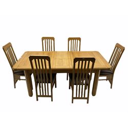Light oak extending dining table, with six matching chairs, the seat pads upholstered in striped grey and black fabric
