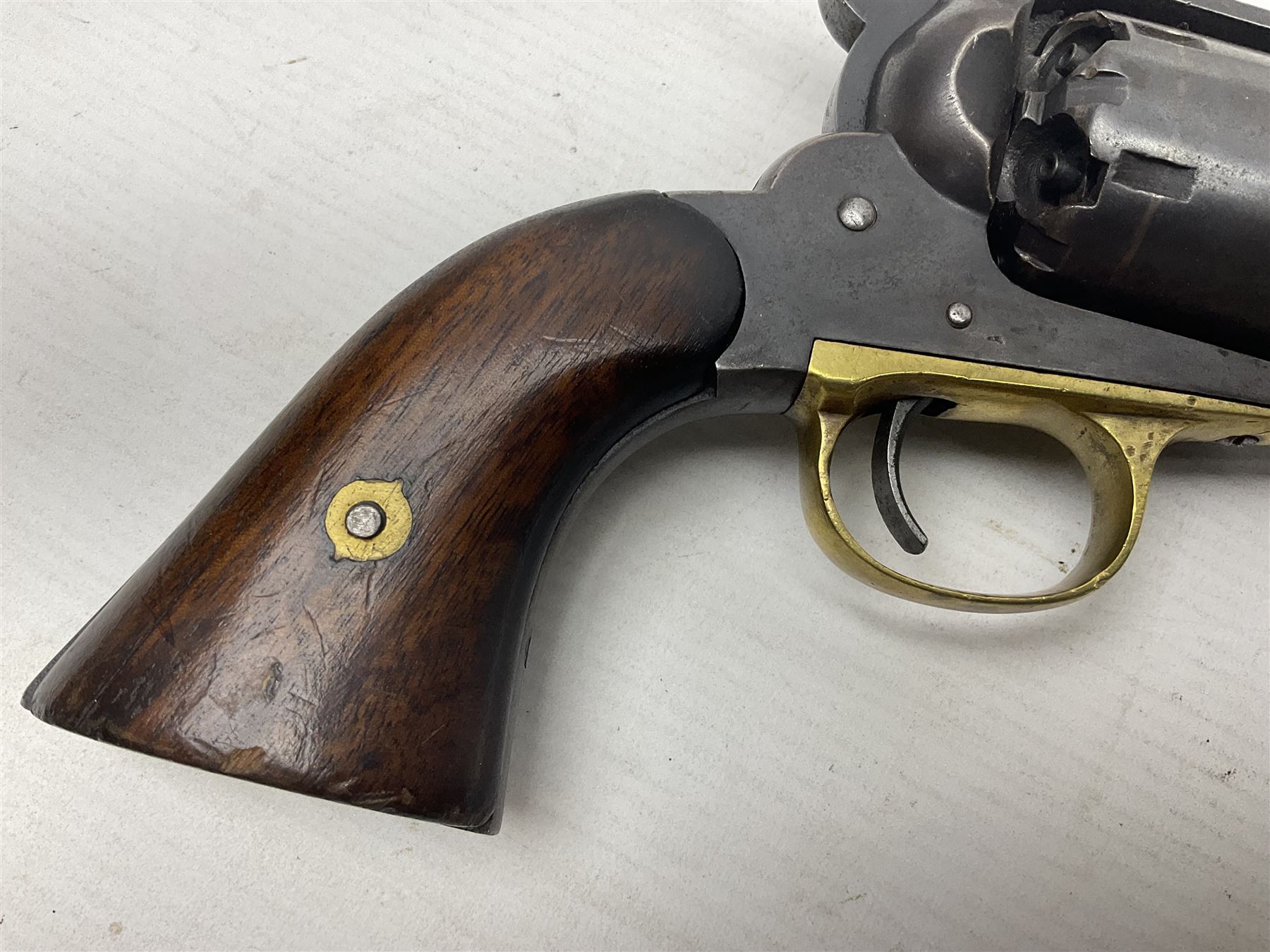 Unmarked Spencer & Rogers type Remington style .44 cal. six-shot percussion revolver, 20cm octagonal barrel with loading lever under, brass trigger guard and two-piece wooden grip L37cm overall; together with a framed watercolour by Alan J. Gray dated 2009 entitled 'The Remington .44 Calibre 1861 Navy Revolver'  19 x 42cm (2)