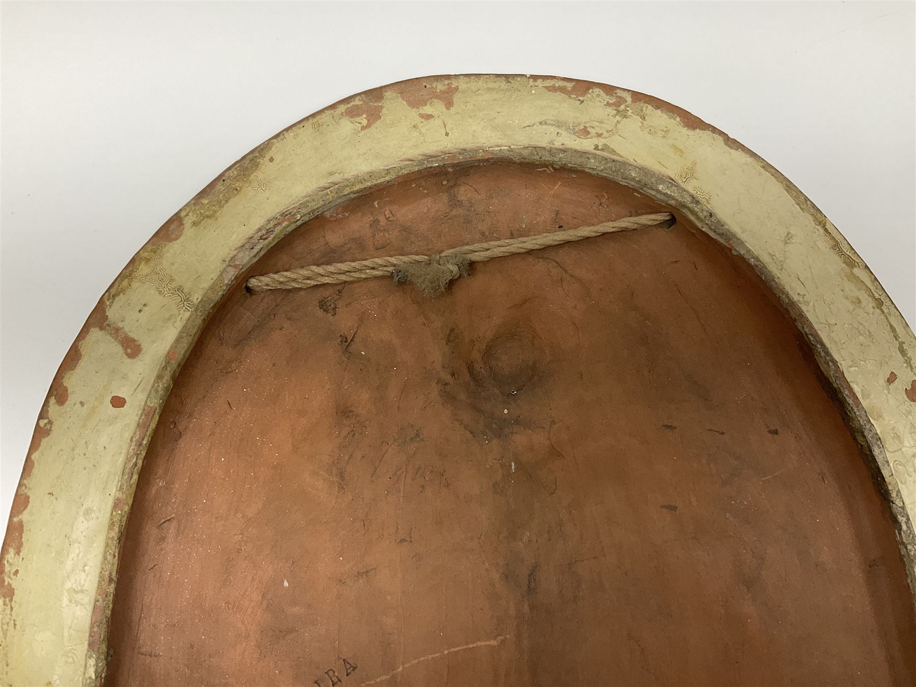 Pair of 19th century classical terracotta relief wall plaques depicting the goddess Hygeia and another goddess, seated holding an ewer, each of oval form, indistinctly signed, each stamped Ferreira verso, H42cm, W30cm