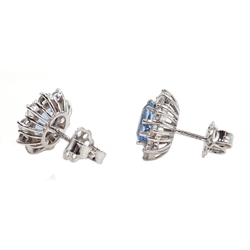 Pair of 18ct white gold aquamarine and diamond cluster stud earrings, hallmarked, aquamarine total weight approx 1.50 carat, diamond total weight approx 0.90 carat

[image code: 5mc]
