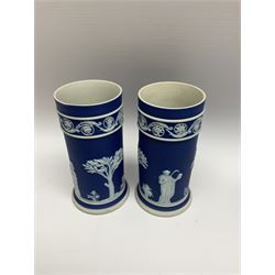Quantity of Wedgwood Jasperware to include pair of 19th century dark blue spill vases decorated with neoclassical figures and motifs, lidded trinket boxes, plates, bowl, cup etc with sage and pink examples