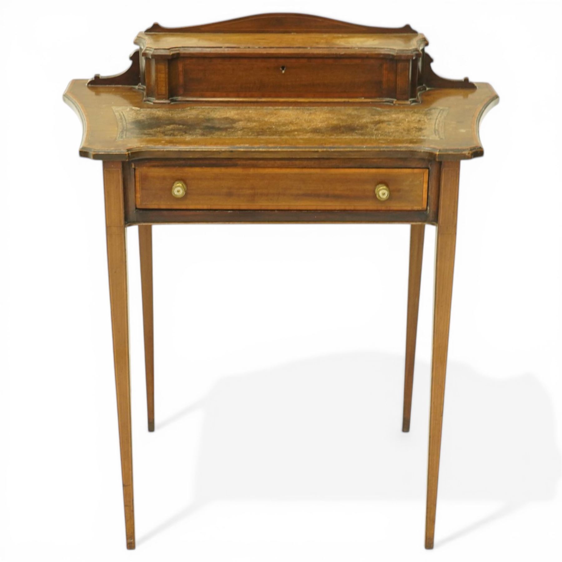 Edwardian inlaid mahogany ladies writing desk, shaped top surmounted with lidded stationary compartment, above a singular drawer, on slender tapering supports