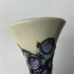 Moorcroft vase, of compressed form with a tall flared neck, decorated in the Juneberry pattern, circa 2000, H25cm