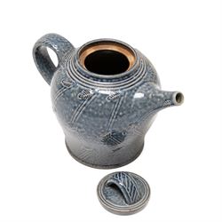 Gus Mableson - two studio pottery teapots, the larger example with a repeating floral pattern upon a brown ground, each with impressed makers marks below the handle, largest H18cm