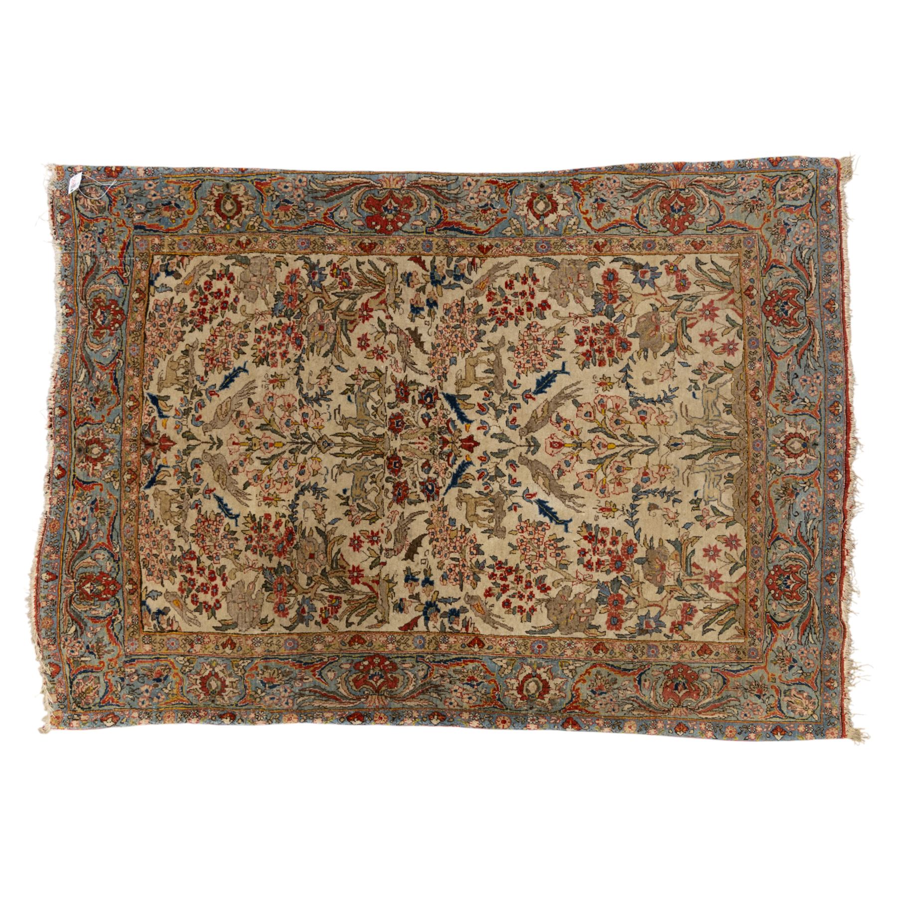 Persian pictorial Kashan rug, ivory field woven with a central tree of life surrounded by flowering plants, birds, and animals, enclosed by a broad turquoise border with scrolling foliage and palmettes
