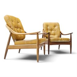 Greaves & Thomas - pair of mid-20th century light elm framed lounge armchairs, with downswept arms and a spindle back, webbing base with makers mark, tan brown leather seat cushions with button back detail