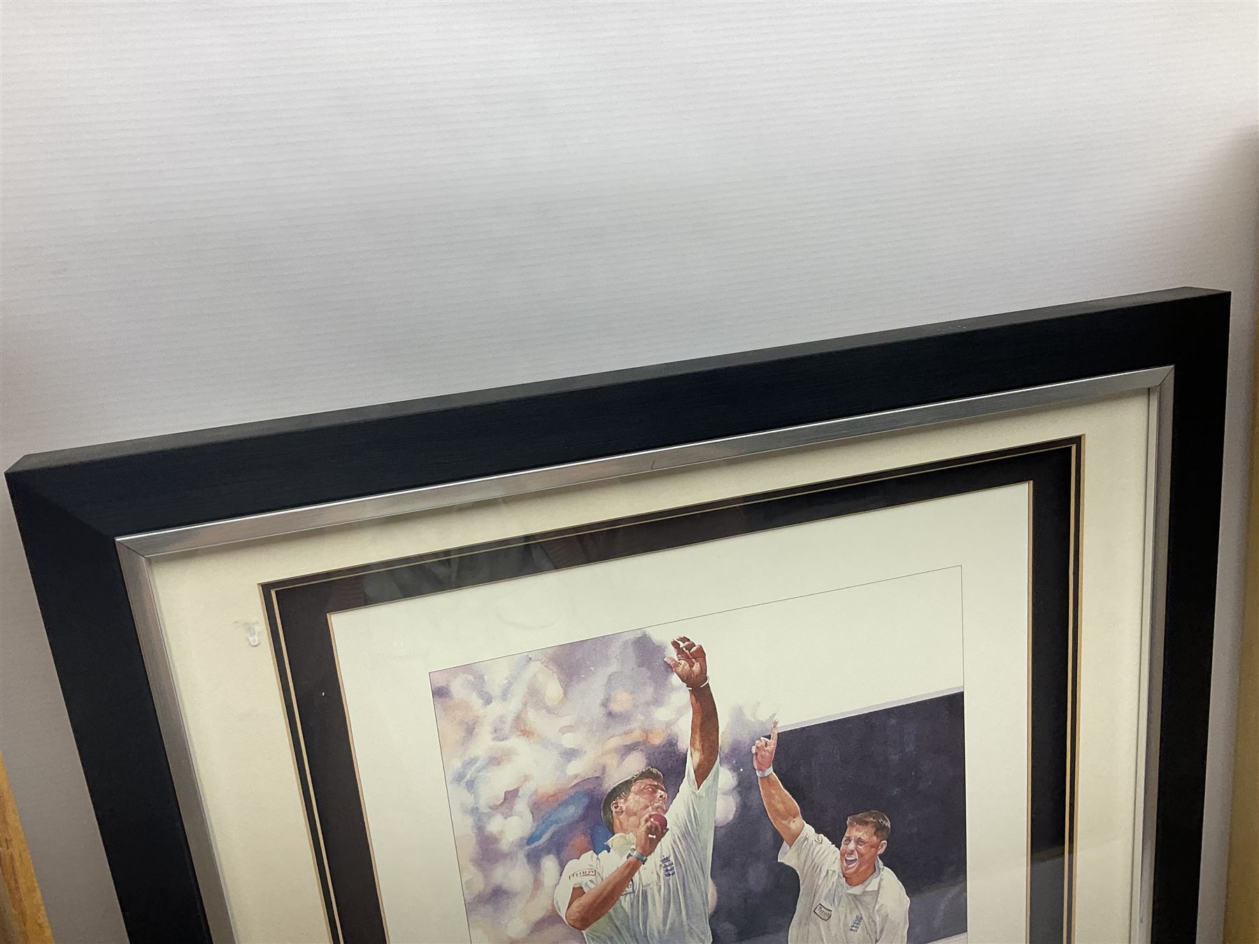 Two signed Yorkshire County cricket bats, bearing signatures including Anthony McGrath, Jacques Rudolph, Michael Vaughn and Matthew Hoggard, etc, both within glazed presentation boxes, box H86.5cm, together with a framed Darren Gough signed presentation print by Gary Keane