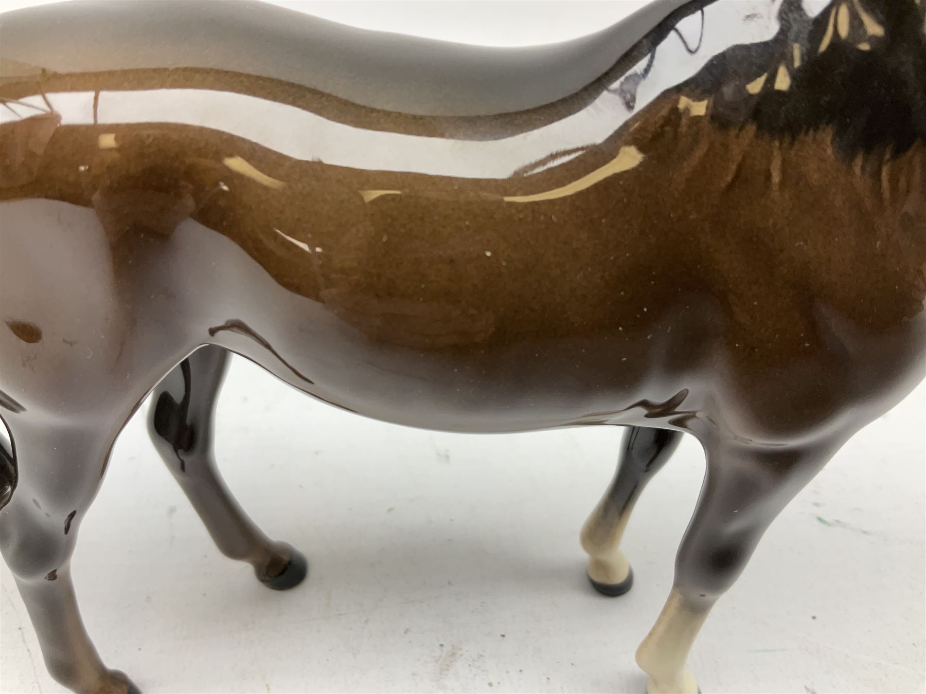 Seven Beswick figures of horses, including Connemara pony in grey no.1641, Arab in bay no.1265, large foal in grey no.947 etc, together with a Goebel figure of a horse (8)