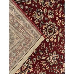 Royal Kashmir worsted wool modern Persian design area rug, with crimson field and stylised rosette patterning throughout, surrounded by wide multi-band border incorporating cartouche and lotus flower motifs