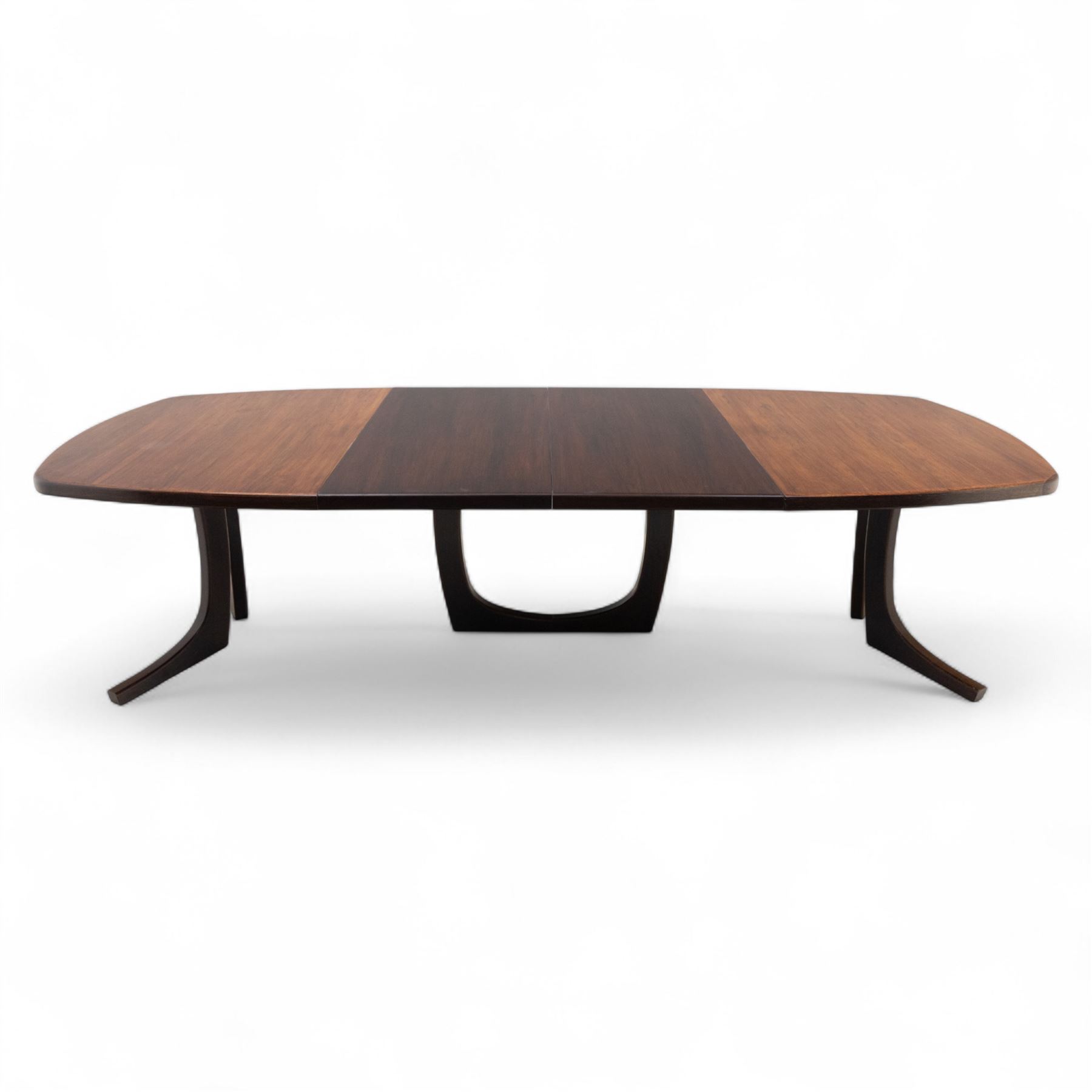 Lynggard Møbler - mid 20th century Danish teak extending dining table, the rounded rectangular veneered top with concealed central leaf, raised on twin sculpted pedestal bases, (Extends to 300cm) combining fine craftsmanship and organic form typical of Scandinavian modern design from the 1960s