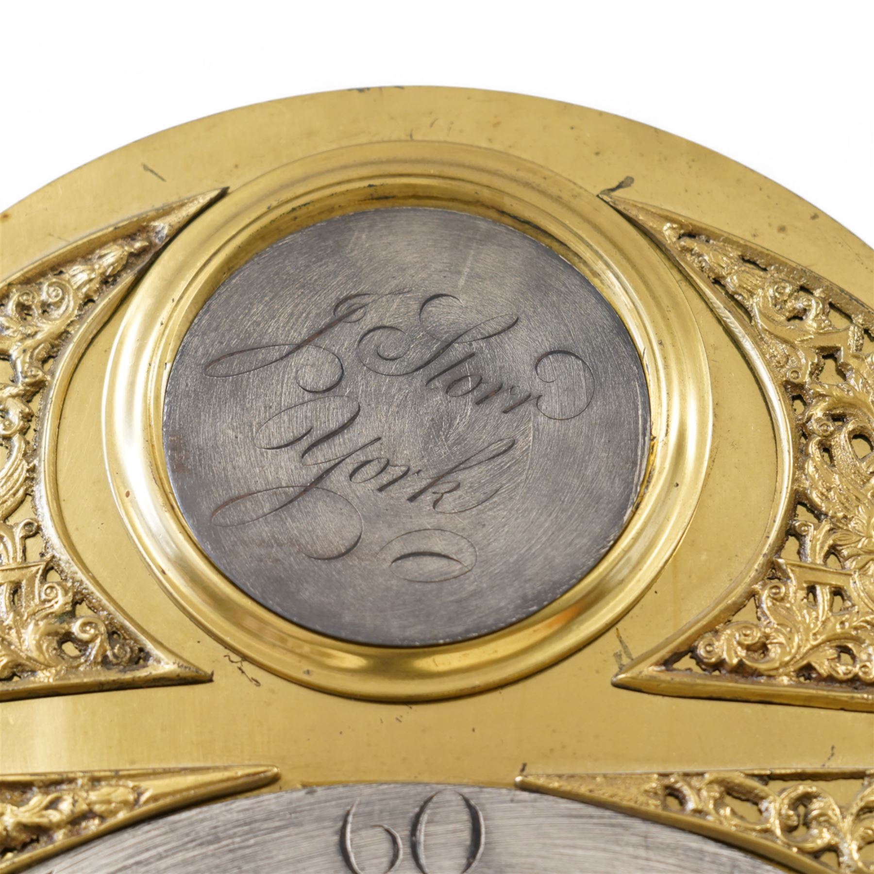 Johnathan Storr of York - 30 hour longcase clock c1770, in a later mahogany case with a decorative swan neck pediment, carved gilded eagle and fretwork, with a dogtooth moulding, break arch hood door and detached pilasters beneath, trunk with a conforming break arch topped door on a square plinth with raised moulding and bracket feet, brass arched dial with makers name to the arch, plain dial centre and silvered chapter ring with Roman numerals, five minute Arabic's, minute track and matching steel hands, chain driven movement with a countwheel strike on a bell. No Pendulum or weight.
Johnathan Storr was an 18th century York clockmaker, working from Petergate and Minster gates in the city centre.