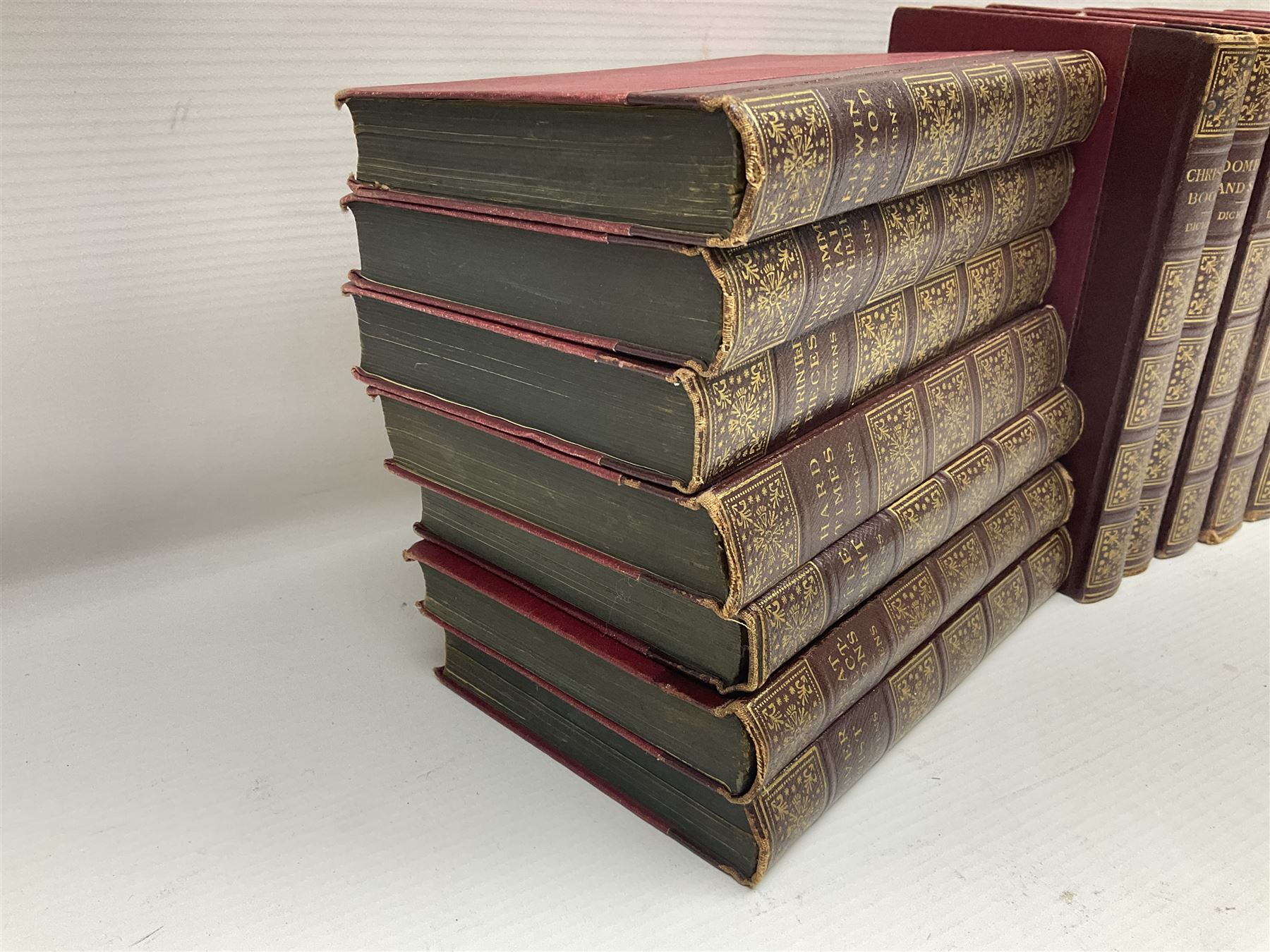 Twenty one volumes of Charles Dickens,  by The Home Library Book company, together with The Readers Digest bedside book of the art of living 