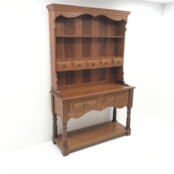 20th century mahogany dresser, raised two tier plate rack with five trinket and two drawers, turned supports joined by solid undertier, W127cm, H198cm